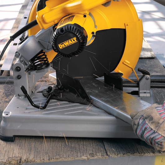 Chop Saw with QUIK-CHANGE™ Keyless Blade Change System blade being used to cut metal